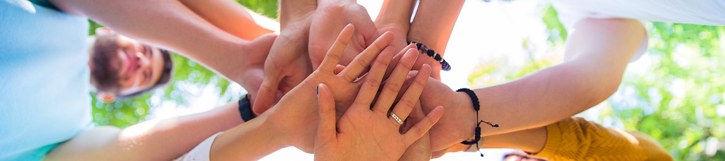 Friends hands together