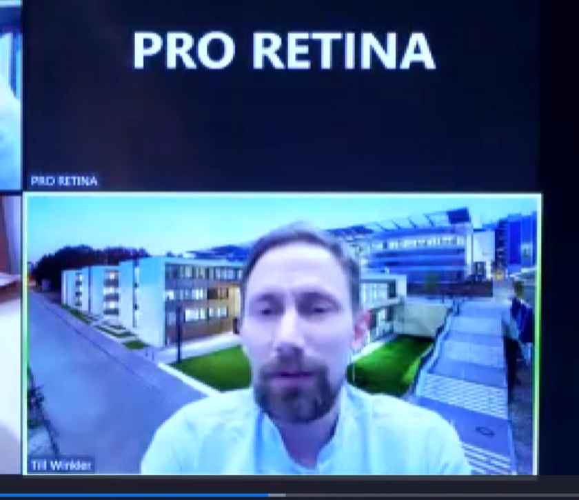 Prof. Dr. Till Winkler,  Copenhagen Business School / FernUniversität Hagen (Foto: ©PRO RETINA) Porträtansicht eines Mannes mit braunen Haaren und Vollbart. Im Hintergrund ein Straßenzug mit mehreren modernen Gebäuden.